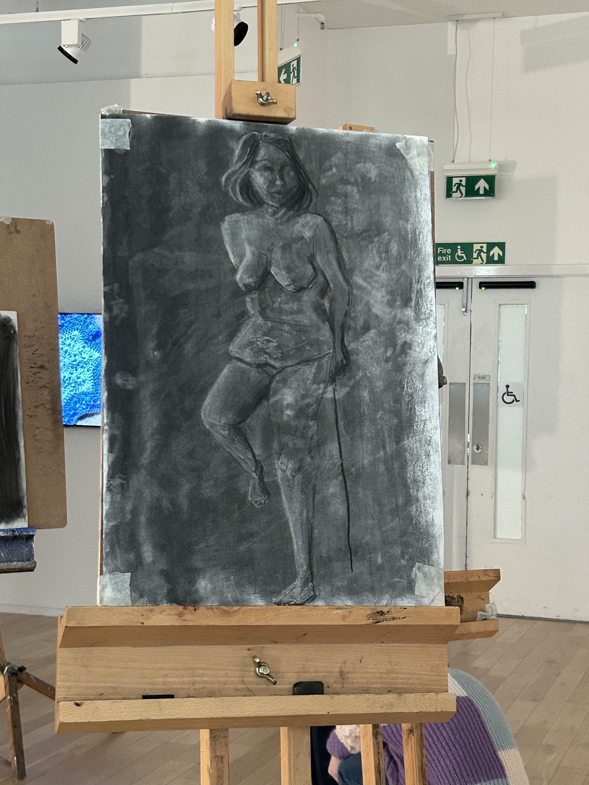 A charcoal study on an easel