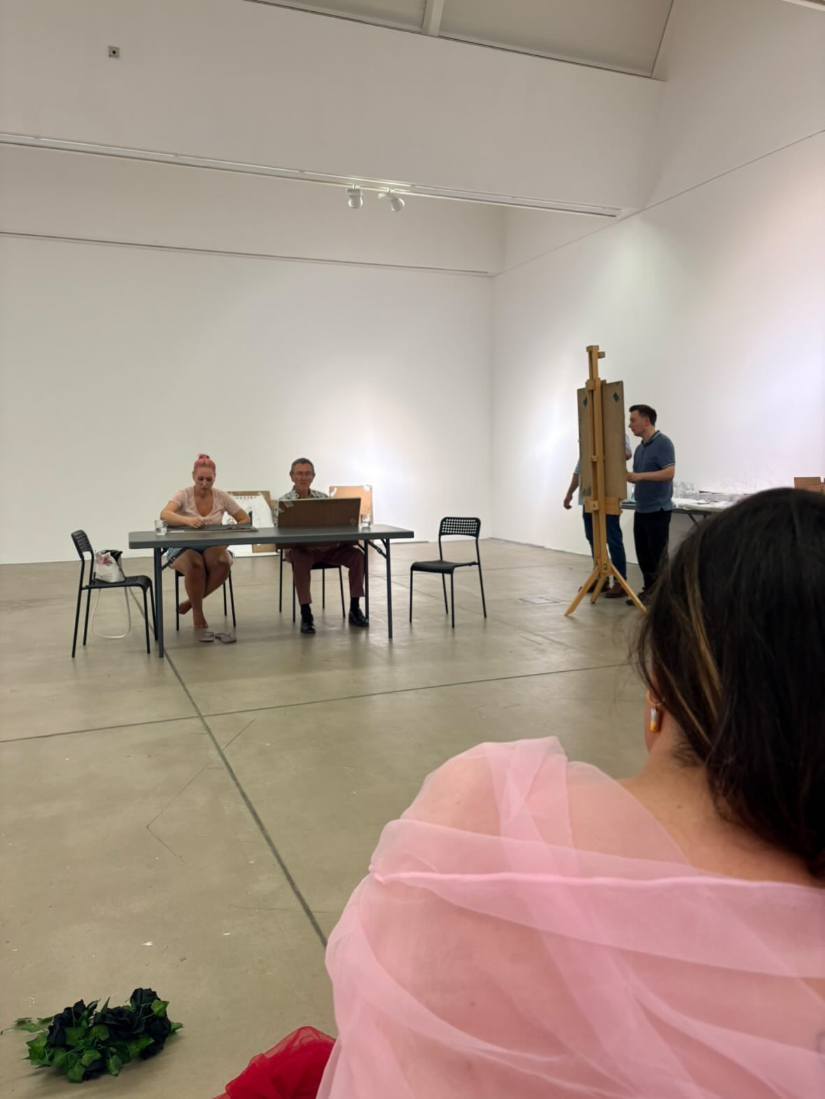 Artists gathered in a studio space