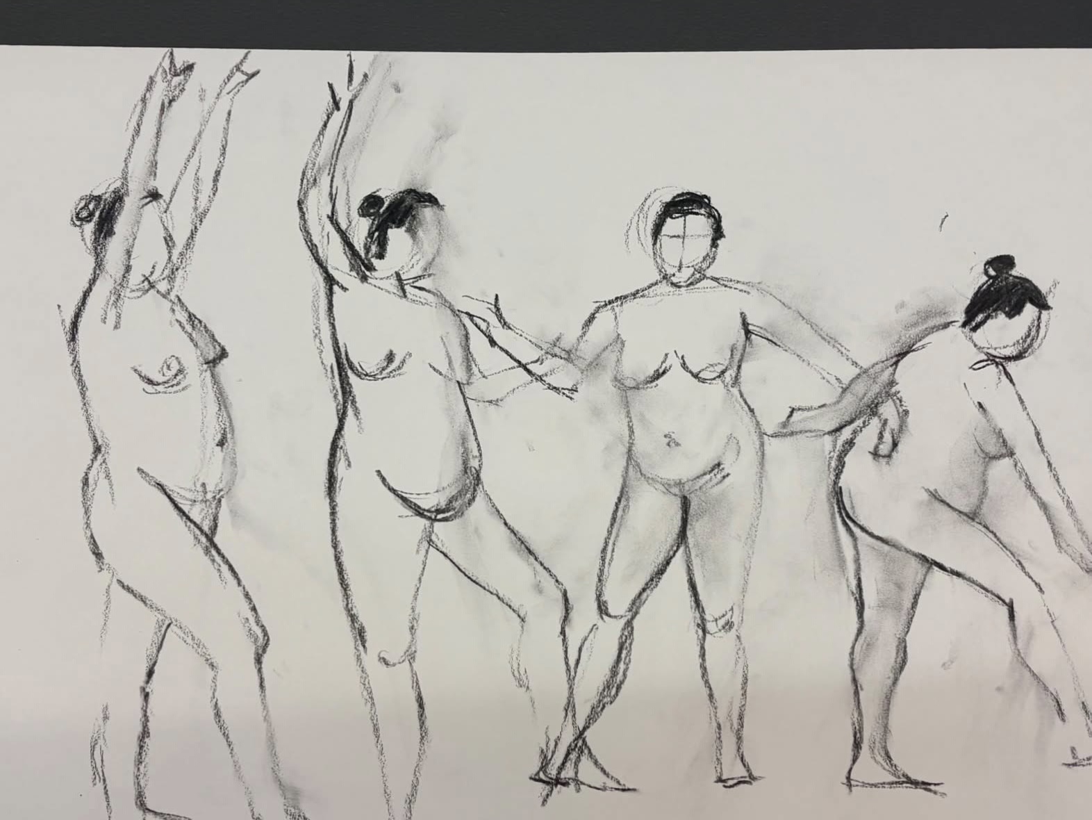 A charcoal study of several standing figures