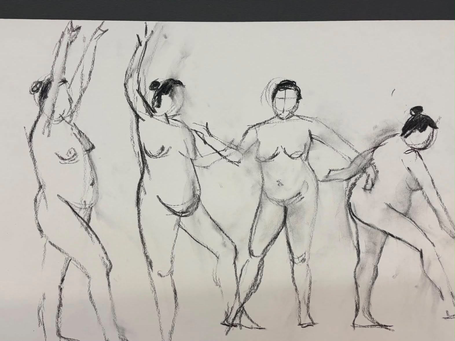 Artists gathered around easels in a warm, lamp-lit studio space